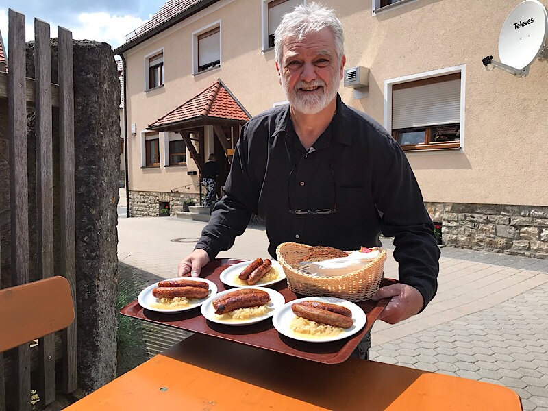 Steve with a tray of bratwurst